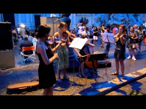 violinists-perform-pachabel-canon-in-d-major-in-fiumi-fountain-in-rome-italy25_thumbnail.jpg